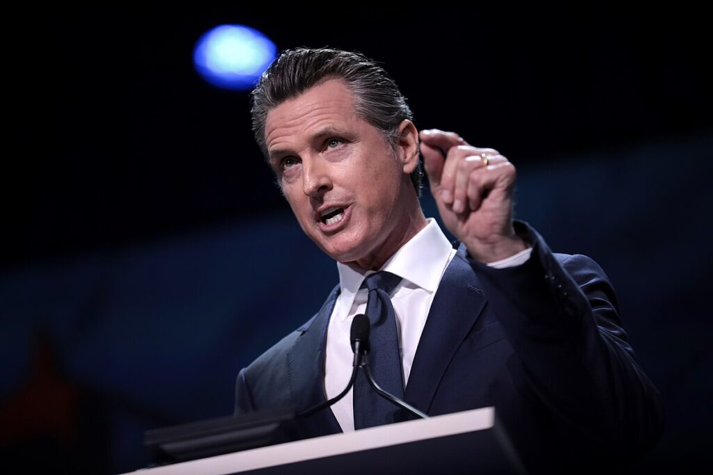 Governor Gavin Newsom signing immigration enforcement reform bills in Los Angeles.
